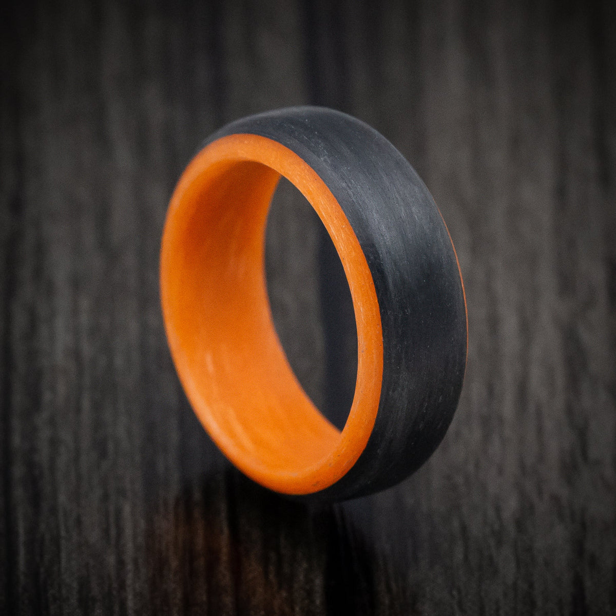 Onyx XIV - Carbon Fiber Men's Wedding Ring with Orange Glow Sleeve - Nura Lab