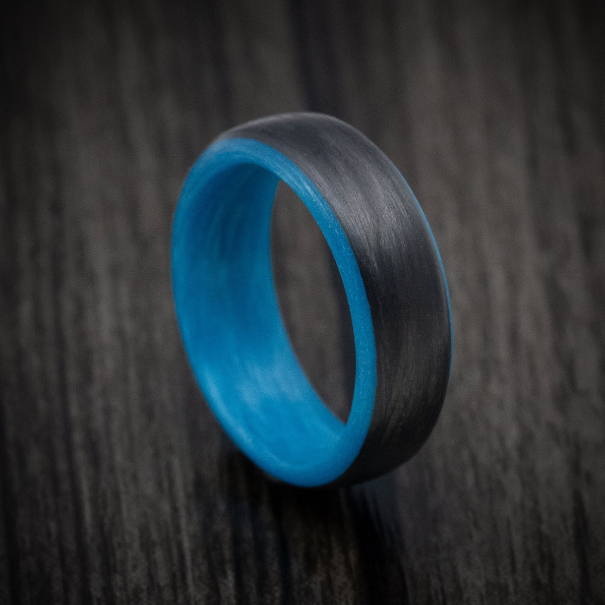 Rimu XIV - Carbon Fiber Men's Wedding Ring with Blue Glow Sleeve - Nura Lab