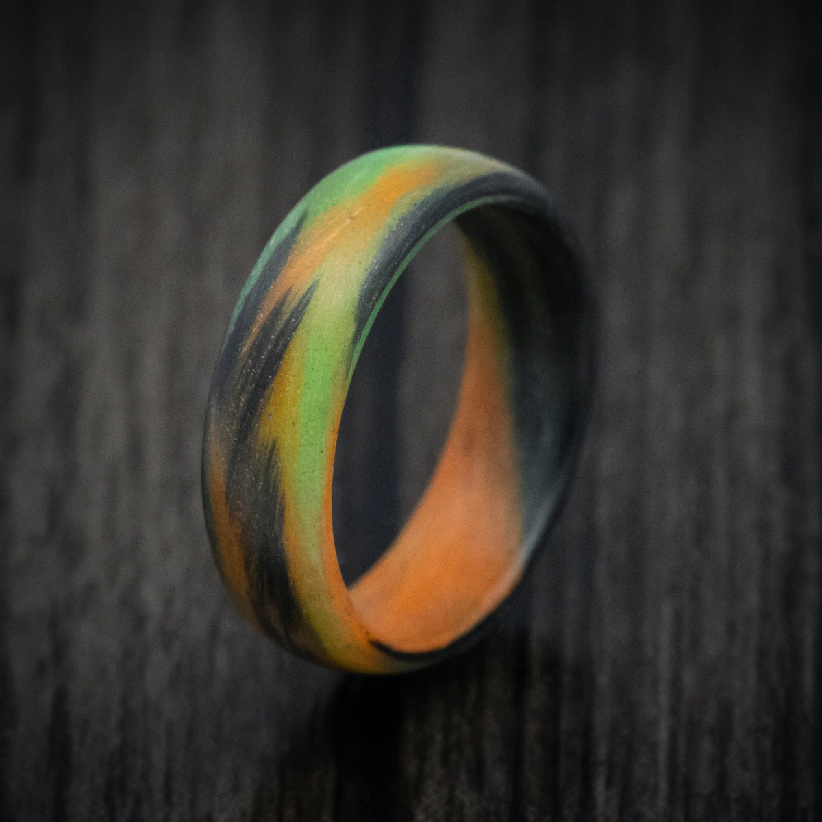 Ember XV - Carbon Fiber Men's Wedding Ring with Orange and Green Glow Marbled Design - view 4 - Nura Lab