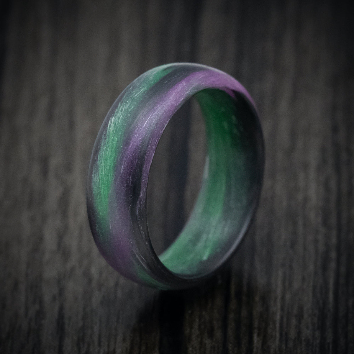 Caesar XIV - Carbon Fiber Men's Wedding Ring with Purple and Green Glow Marbled Design - view 4 - Nura Lab