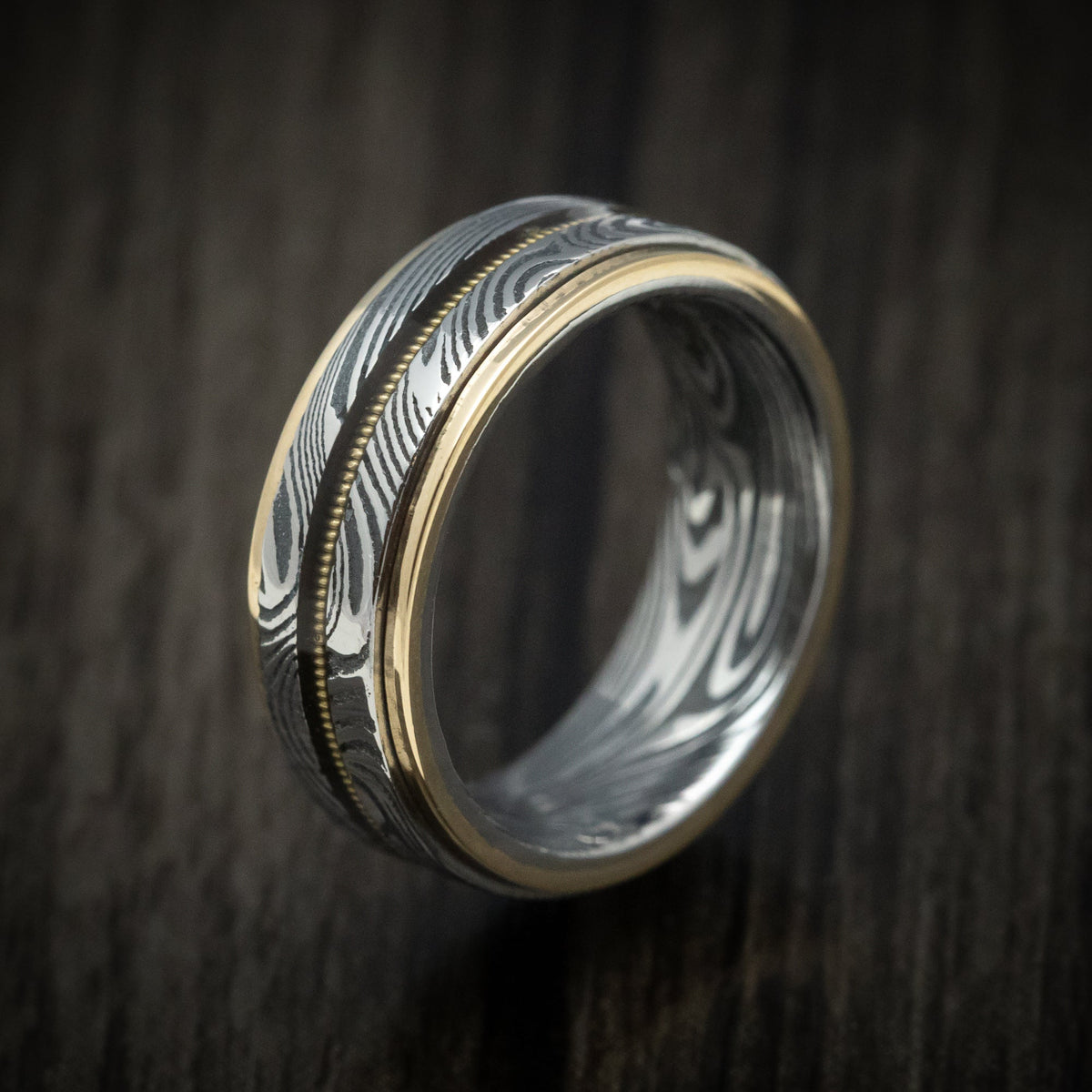 Augustus X - Sunset Kuro Damascus Steel and Guitar String Men's Wedding Ring with Gold Edges - view 4 - Nura Lab