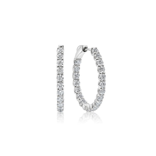 Side profile of 23.5 mm diamond huggie earrings showing hinged click clasp