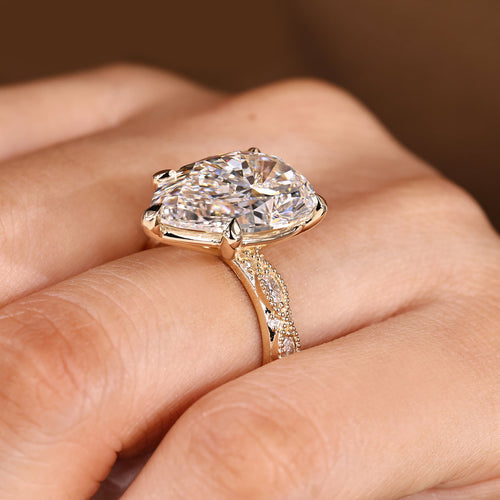 Elodie Grace - 10 Carat Pear Shaped Diamond Ring with Marquise and Round Pave