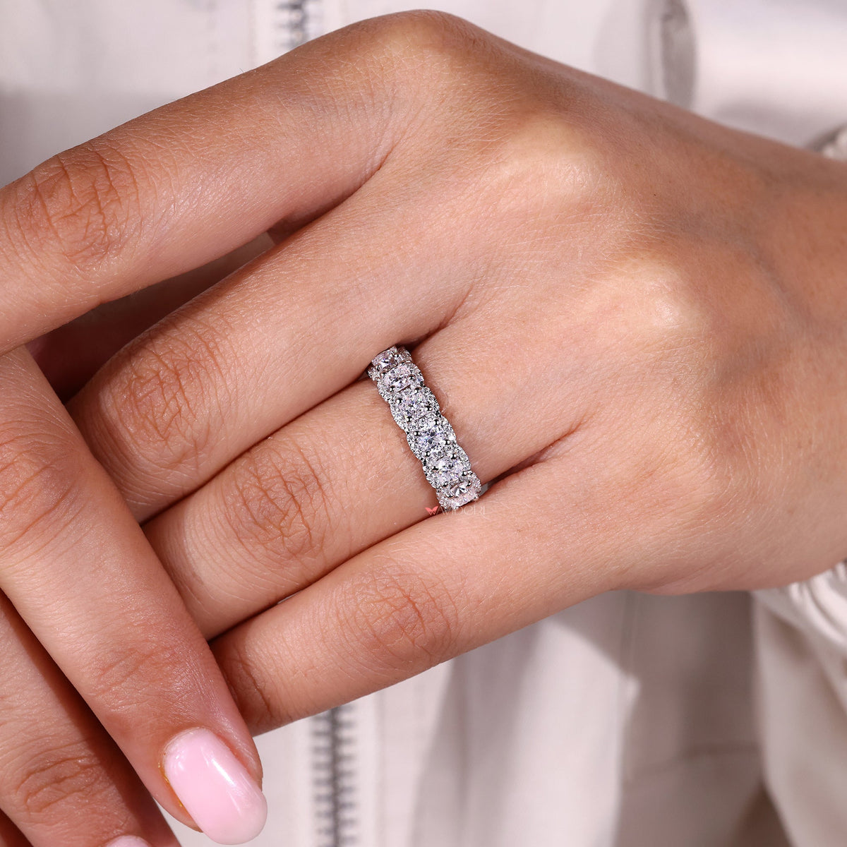 Buy wedding band featuring moissanite stones.
