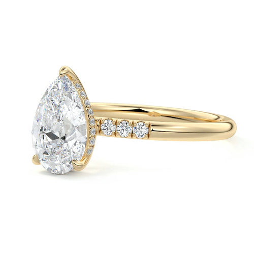 Elodie pear hidden halo side stone lab grown diamond engagement ring in yellow gold