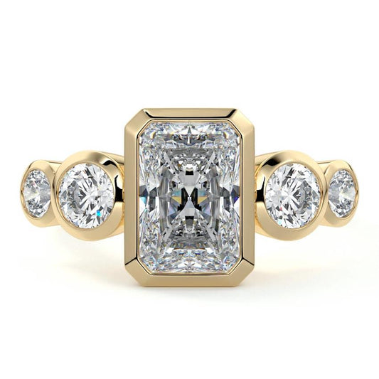 Evelina radiant bezel side stone lab grown diamond engagement ring in yellow gold