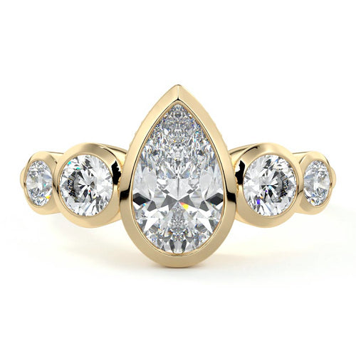 Evelina pear bezel side stone lab grown diamond engagement ring in yellow gold