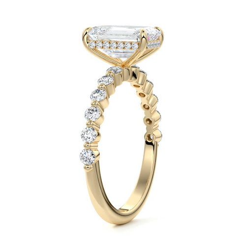 Odessa emerald cut hidden halo side stone lab grown diamond engagement ring in yellow gold