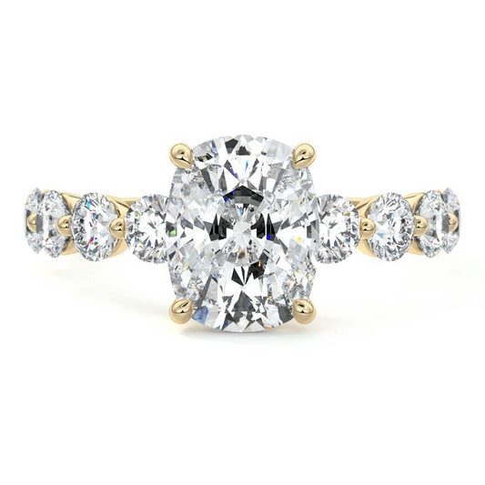 Aria cushion graduated side stone lab grown diamond engagement ring in yellow gold