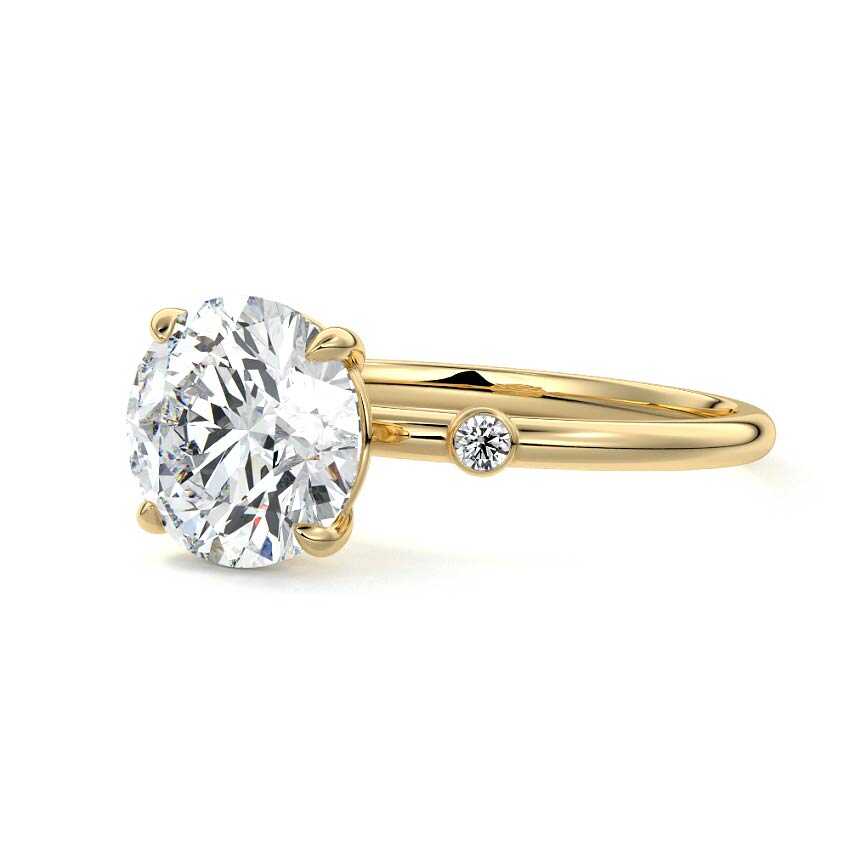 Eira round side stone lab grown diamond engagement ring in yellow gold