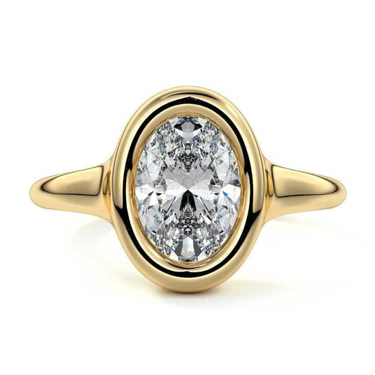 Gianna oval bezel solitaire lab grown diamond engagement ring in yellow gold