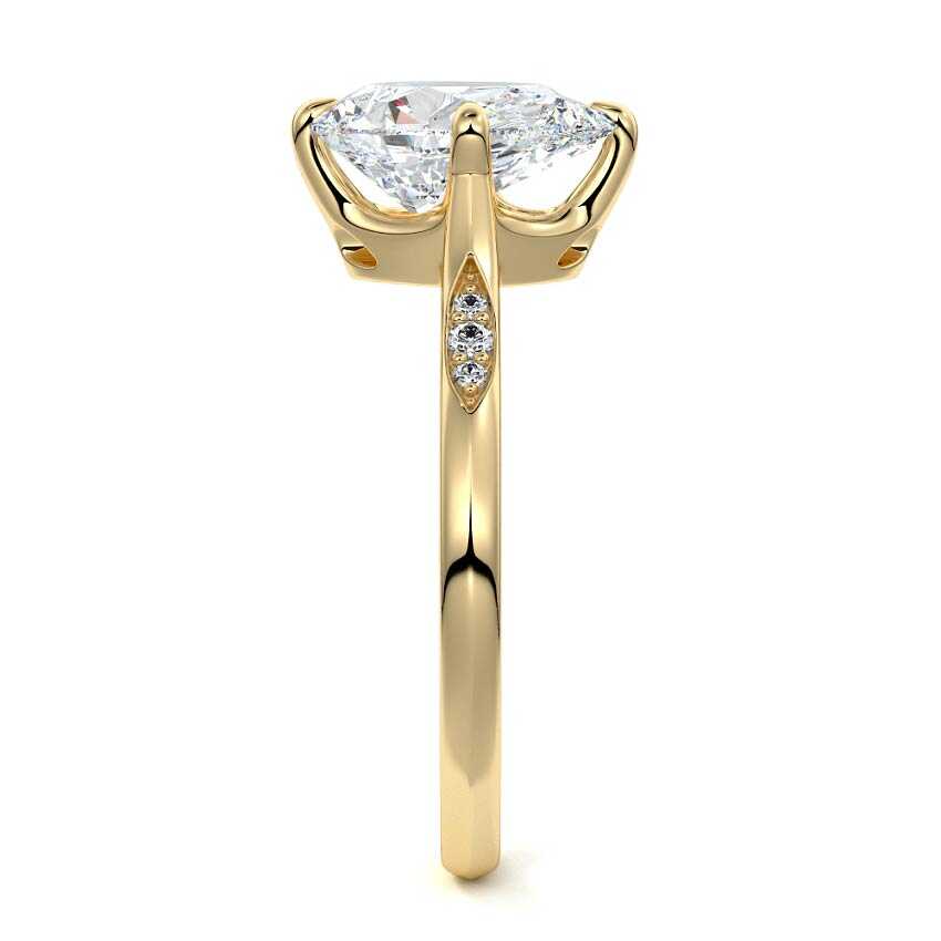 Kaia pear flush set side stone lab grown diamond engagement ring in yellow gold