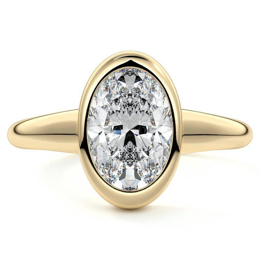 Oriana oval bezel solitaire lab grown diamond engagement ring in yellow gold