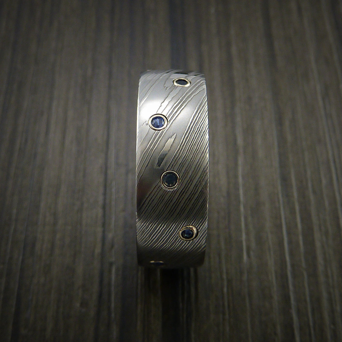 Maverick XI - Damascus Steel Men's Wedding Ring with Bezel Set Blue Sapphires Custom Band - view 5 - Nura Lab
