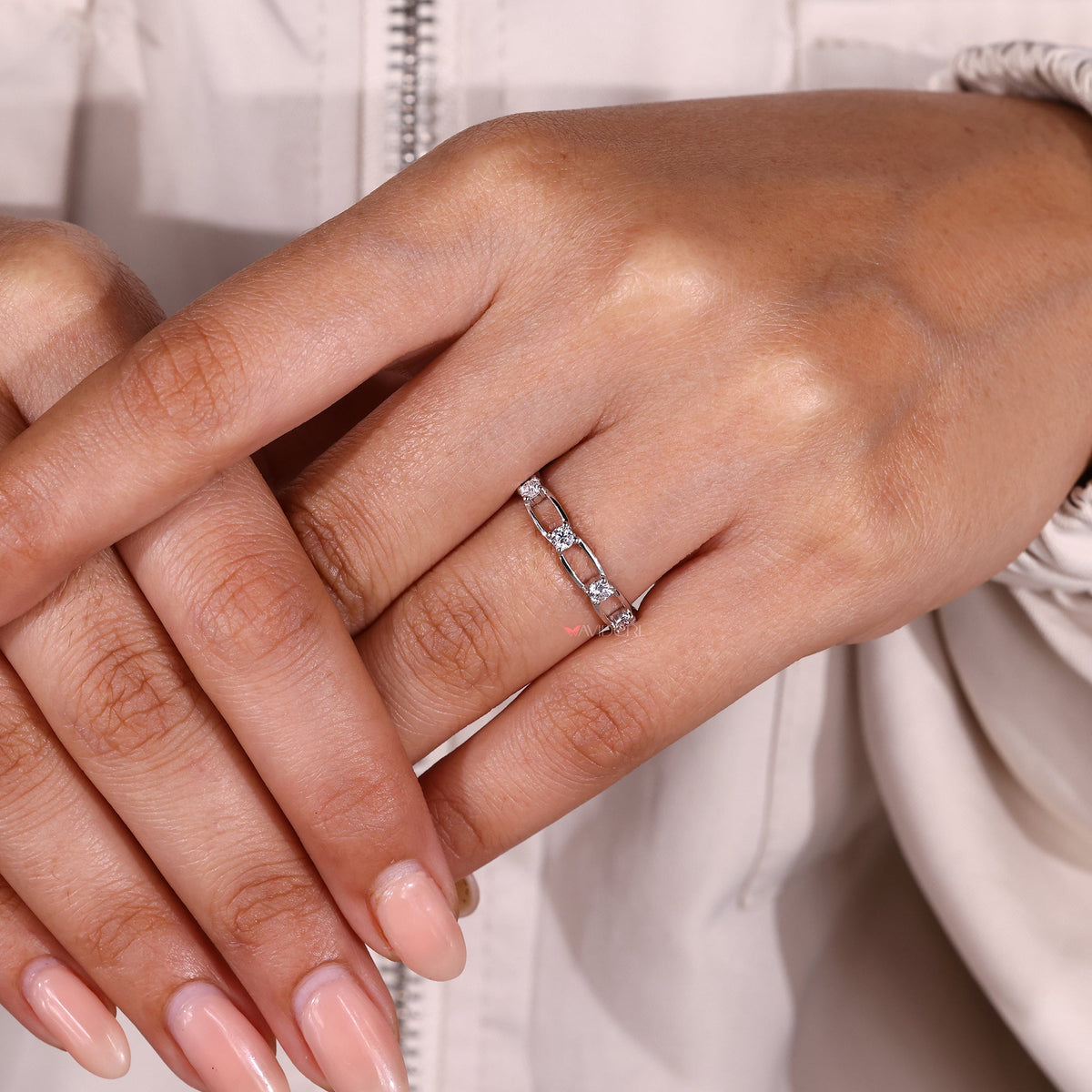 Moissanite band with distance pave setting.
