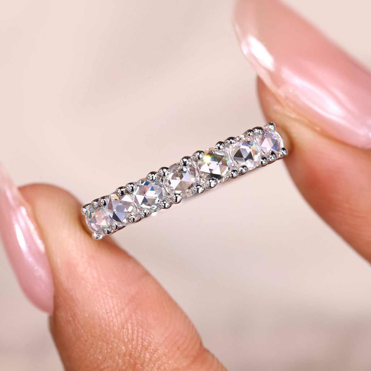Rose cut wedding ring reflects vintage charm with soft, glowing facets and clean styling.
