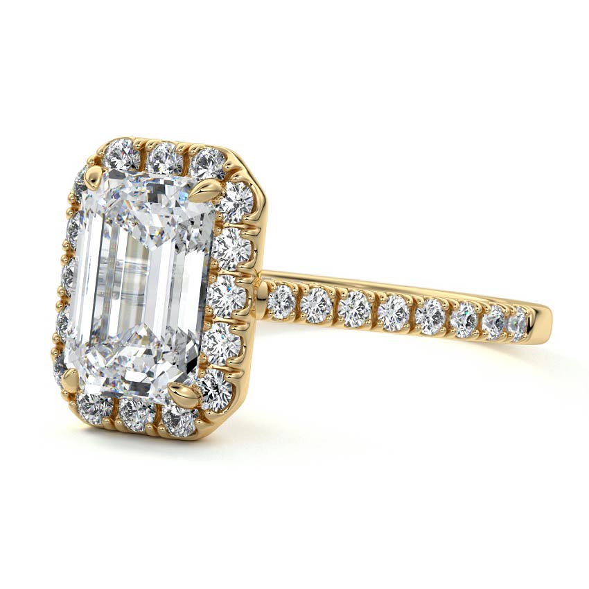 emerald cut halo engagement ring in yellow gold