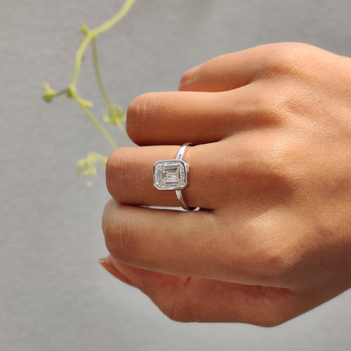 Rosamund Anne - Emerald Engagement Ring With Bezel Setting