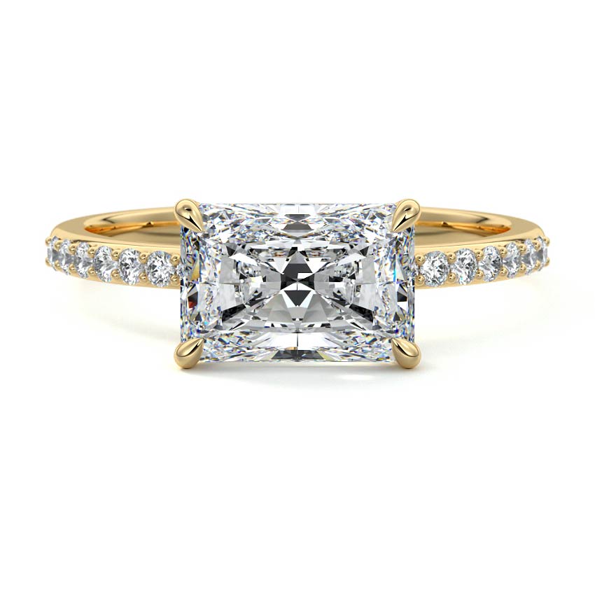 Catrina east-west radiant lab grown diamond engagement ring with pavé band in yellow gold
