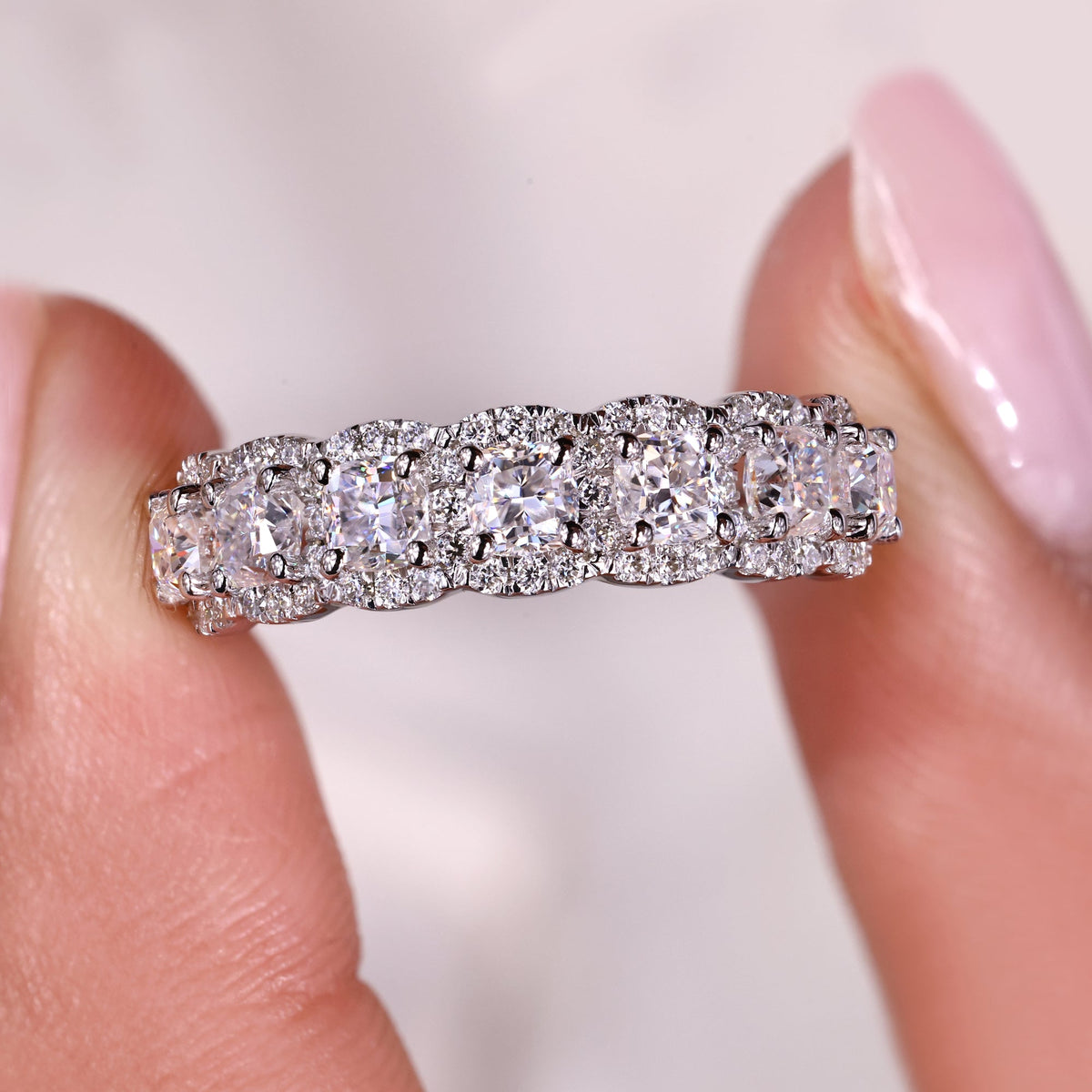 Moissanite half eternity wedding band with seven stones.