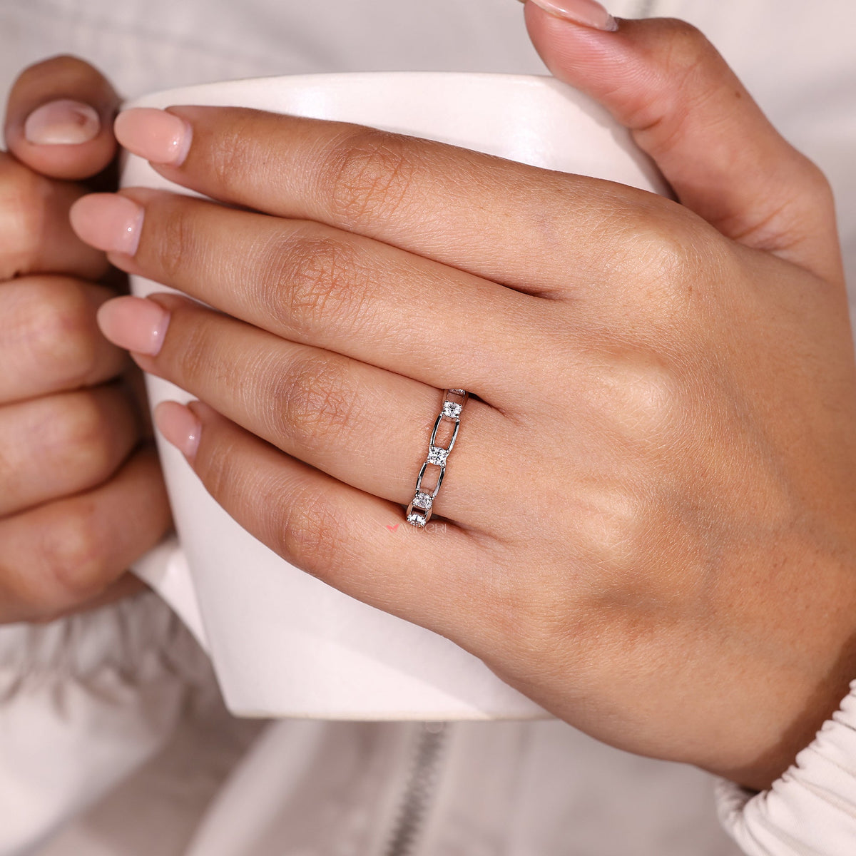 Moissanite eternity band with distance pave design.
