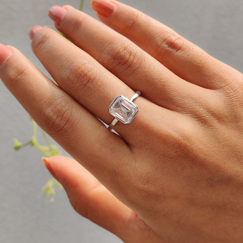 Rosamund Anne - Emerald Engagement Ring With Bezel Setting