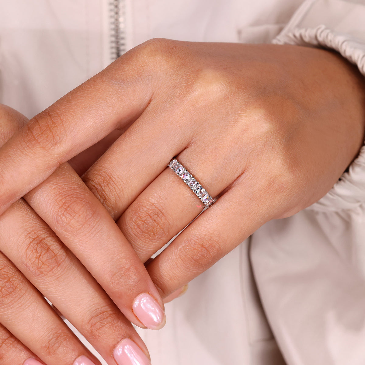 Rose cut design shines softly across seven stone white gold wedding styles.
