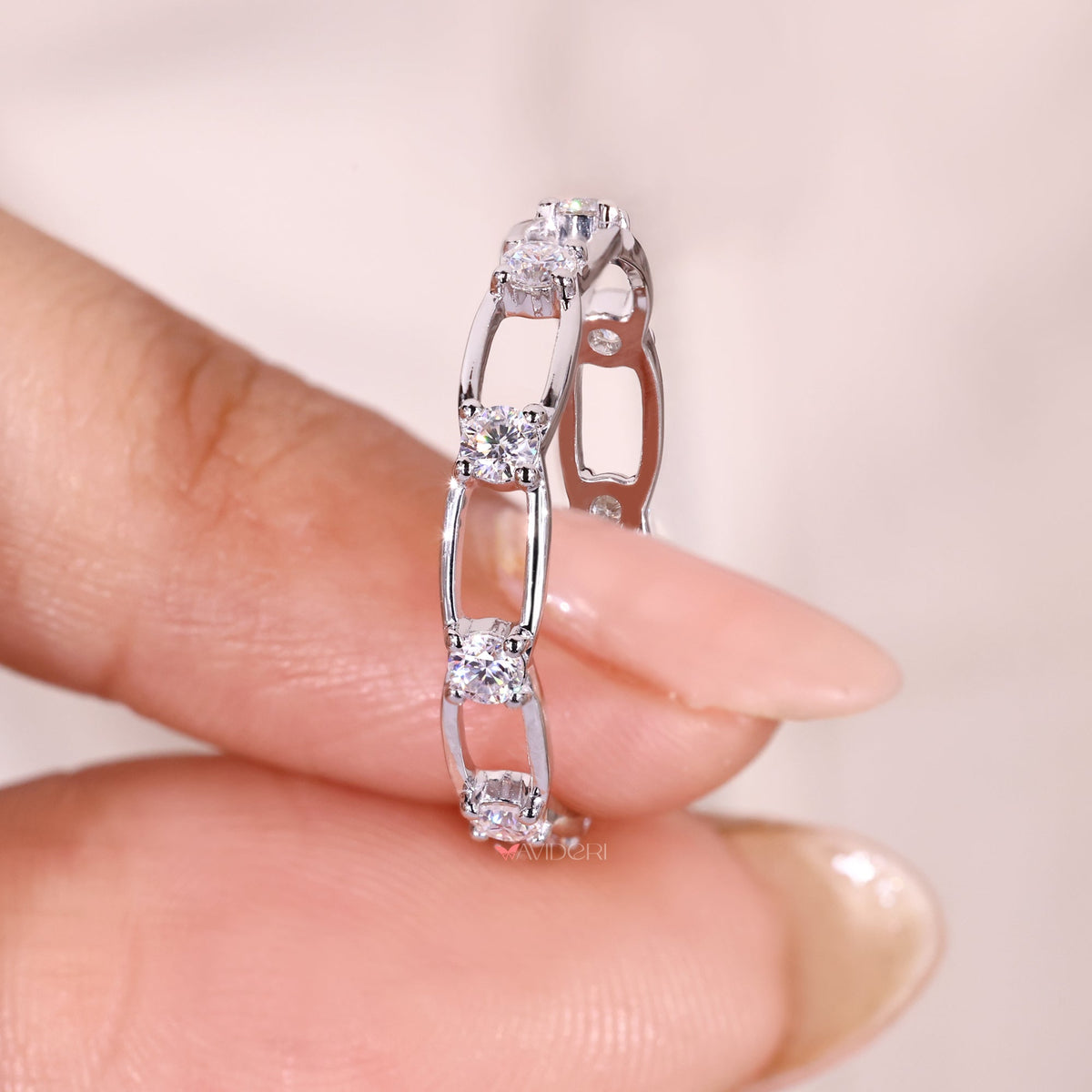 Round moissanite link style eternity band.

