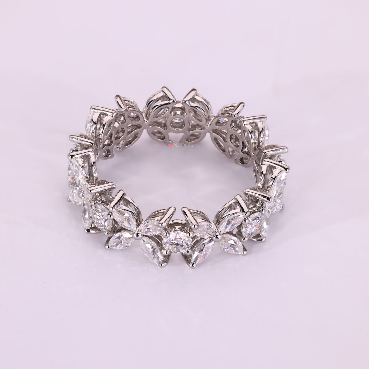 The white gold wedding band gives a smooth, polished finish.