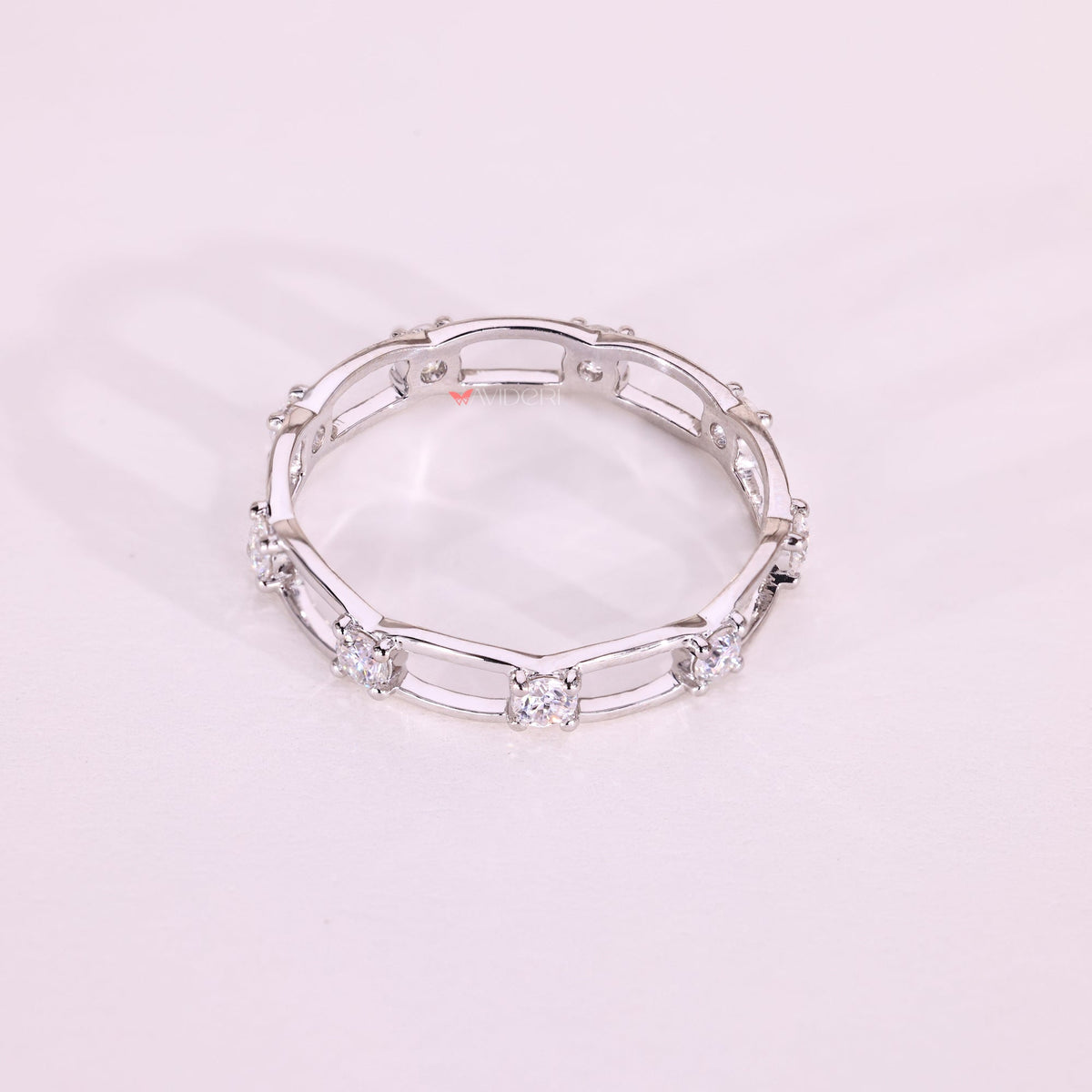 Elegant round moissanite eternity wedding ring.
