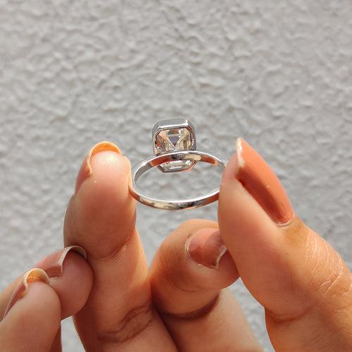 Rosamund Anne - Emerald Engagement Ring With Bezel Setting