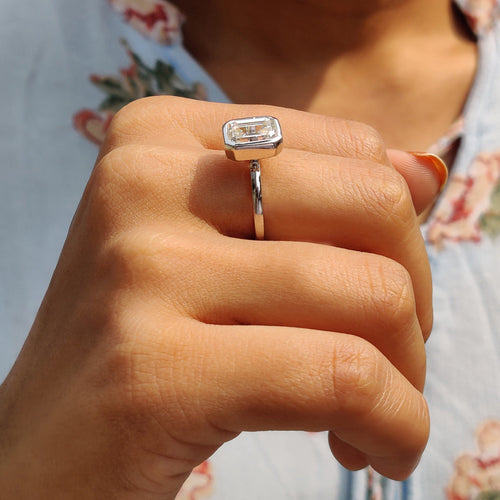 Rosamund Anne - Emerald Engagement Ring With Bezel Setting