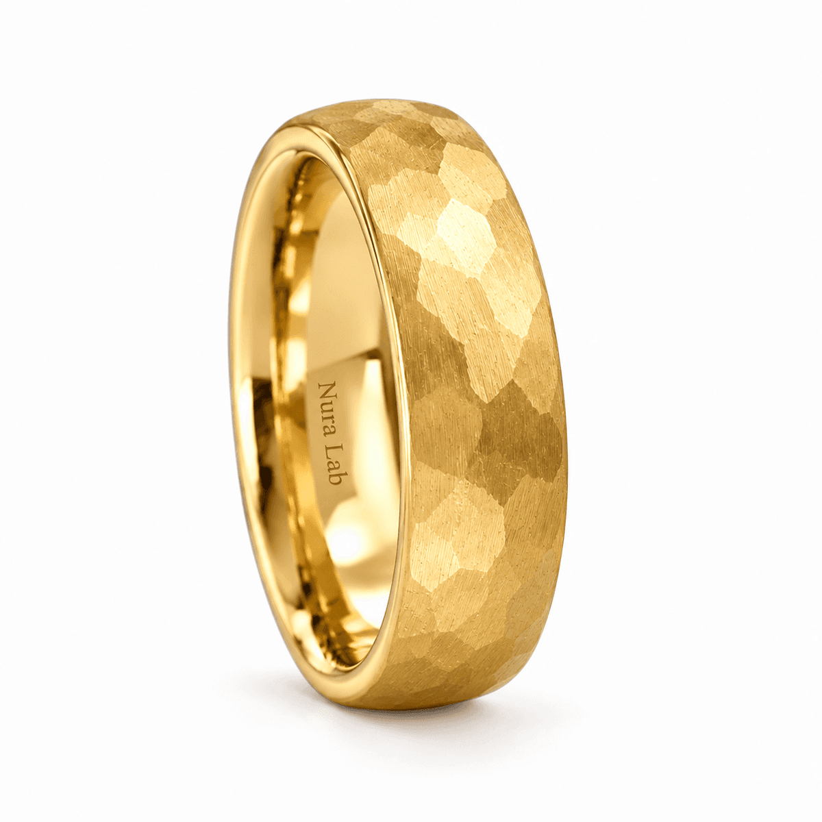 Nura III hammered gold tungsten wedding ring on white studio background