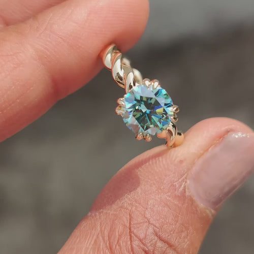 Genevieve Claire - Cyan Blue Round Cut Hidden Halo Ring With Twisted Rope Band - product video