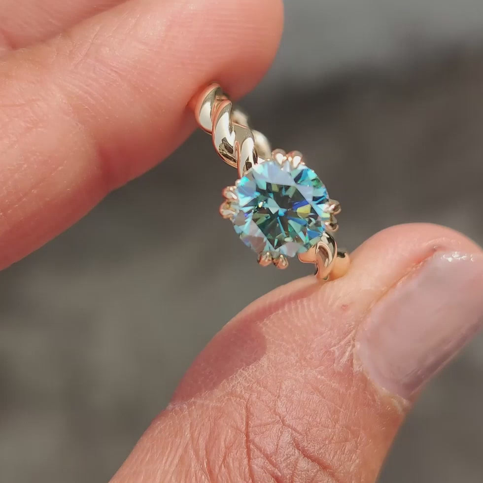 Genevieve Claire - Cyan Blue Round Cut Hidden Halo Ring With Twisted Rope Band - product video