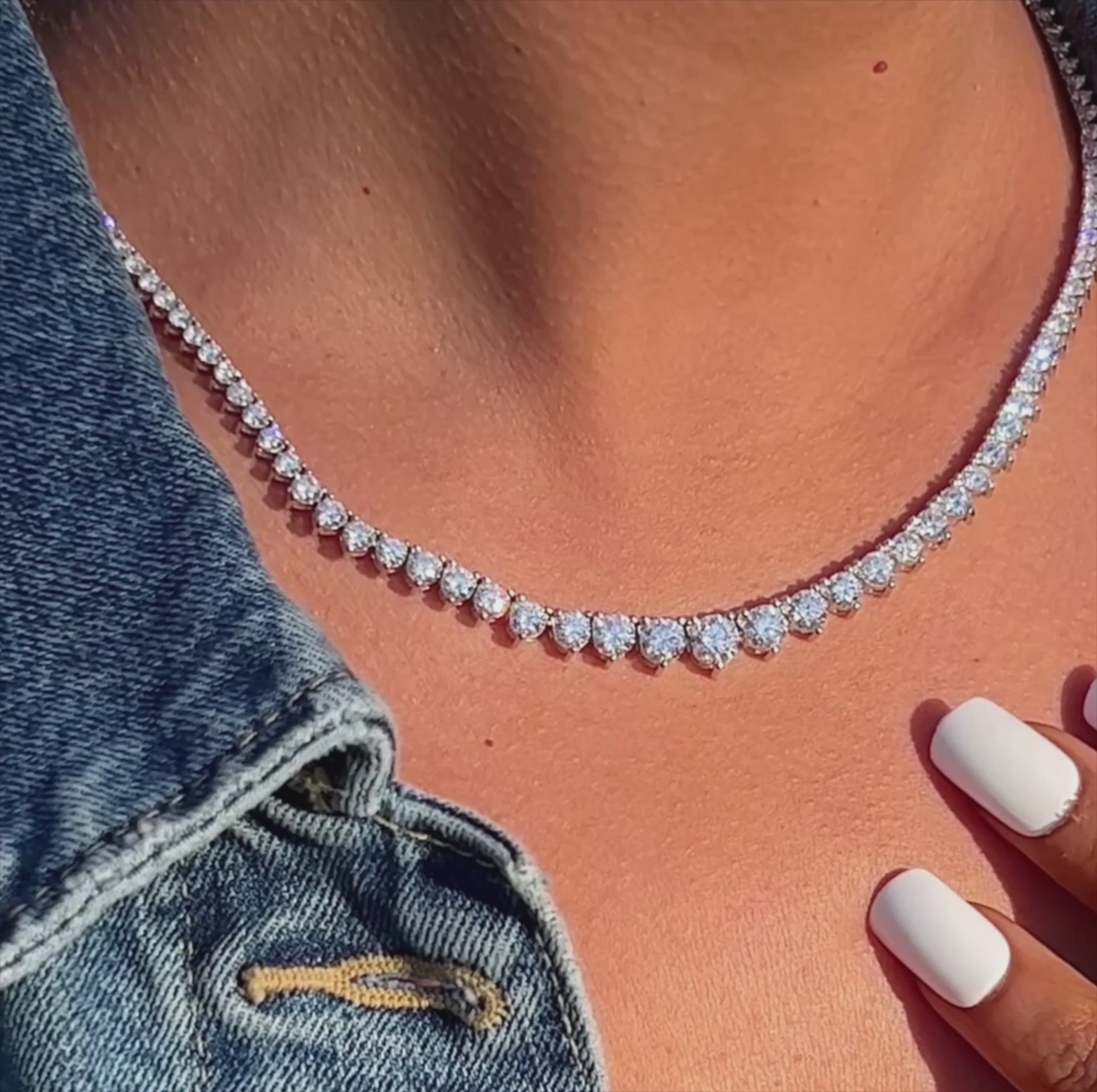 Lab-grown diamond Riviera necklace in 14K white gold styled on model’s neckline