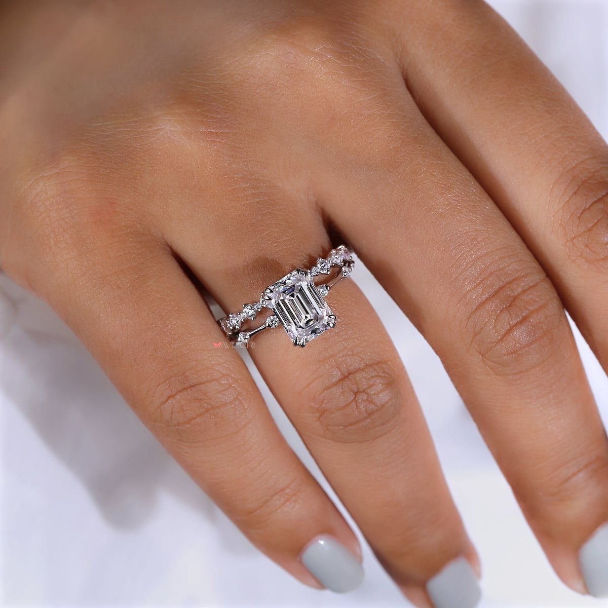 Delicate round moissanite half eternity band.
