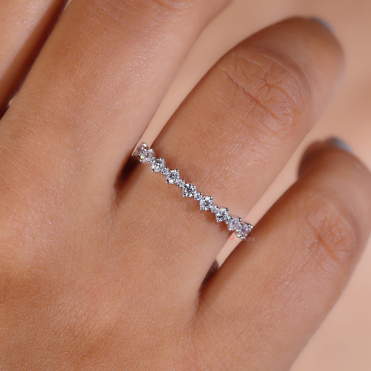 Minimal round moissanite half eternity ring.
