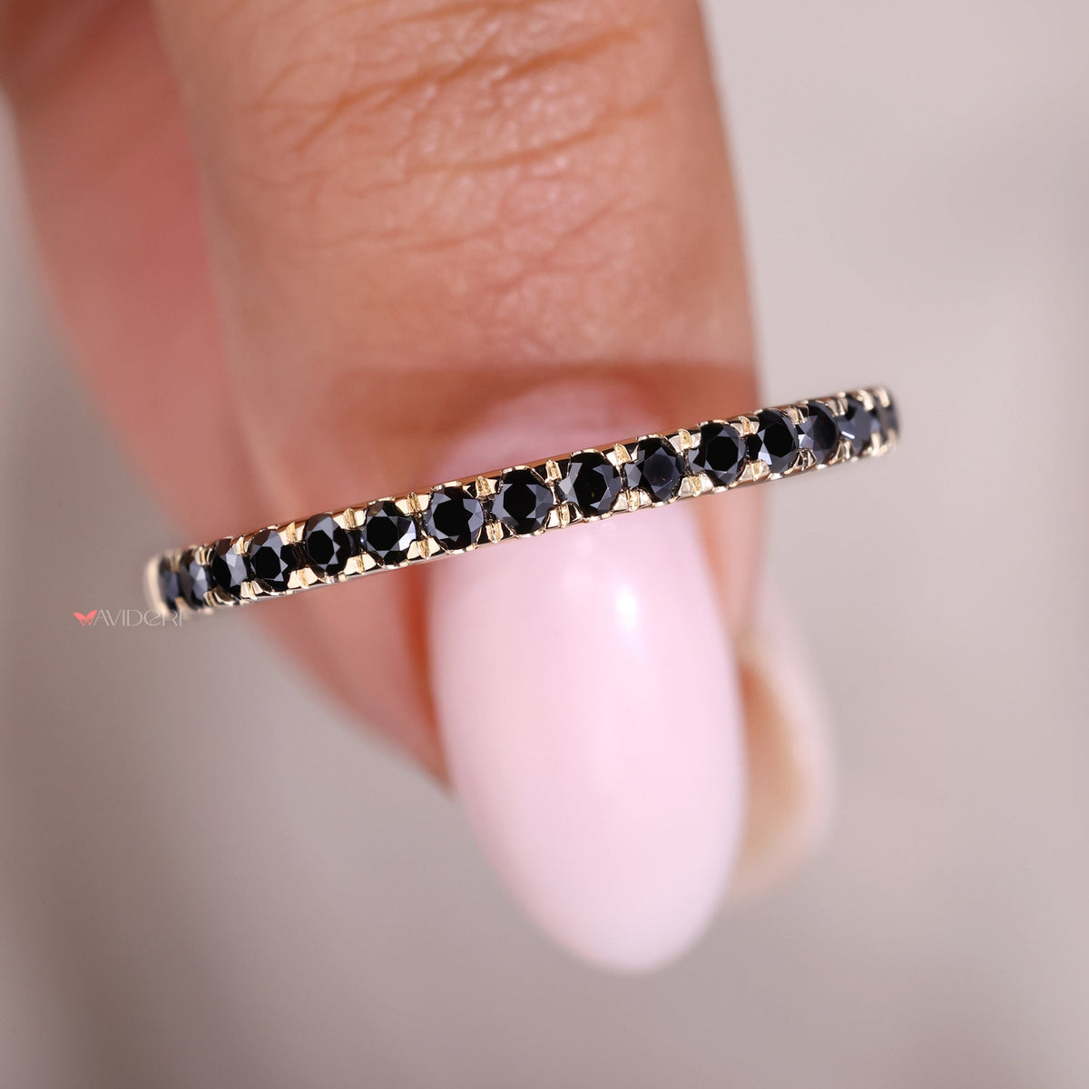 Round eternity band set in a Yellow gold band wedding for timeless elegance.
