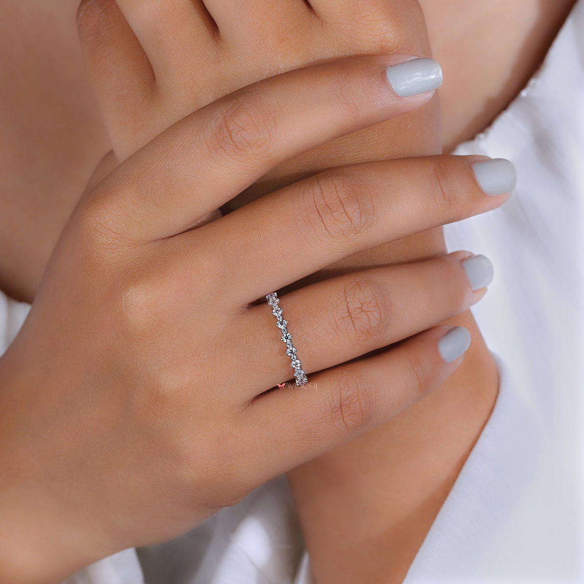 Handmade prong set moissanite eternity band.
