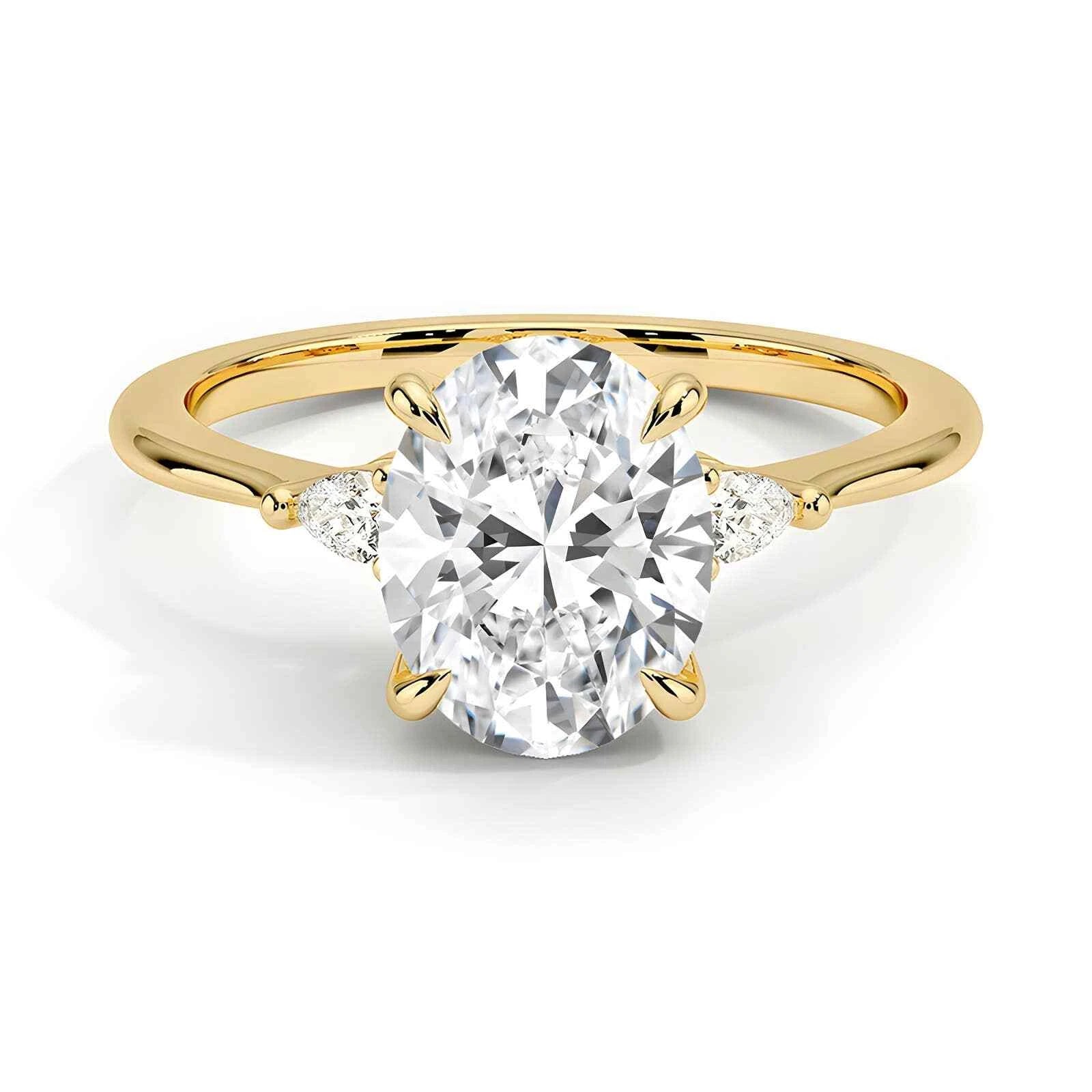 Three stone oval cut moissanite engagement ring in yellow, rose, white gold and platinum – handcrafted in New Zealand by Nura Lab