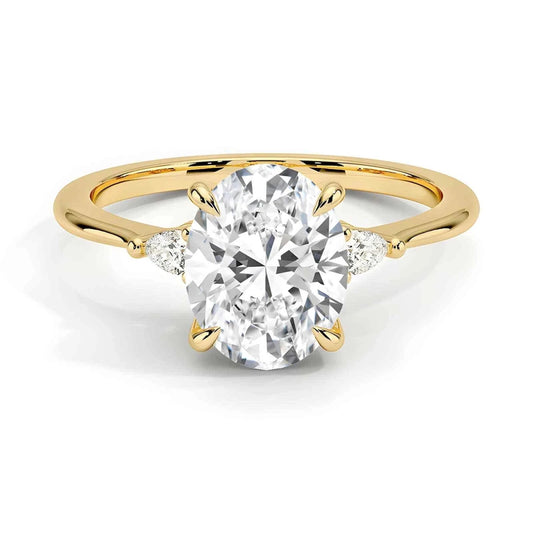 Three stone oval cut moissanite engagement ring in yellow, rose, white gold and platinum – handcrafted in New Zealand by Nura Lab