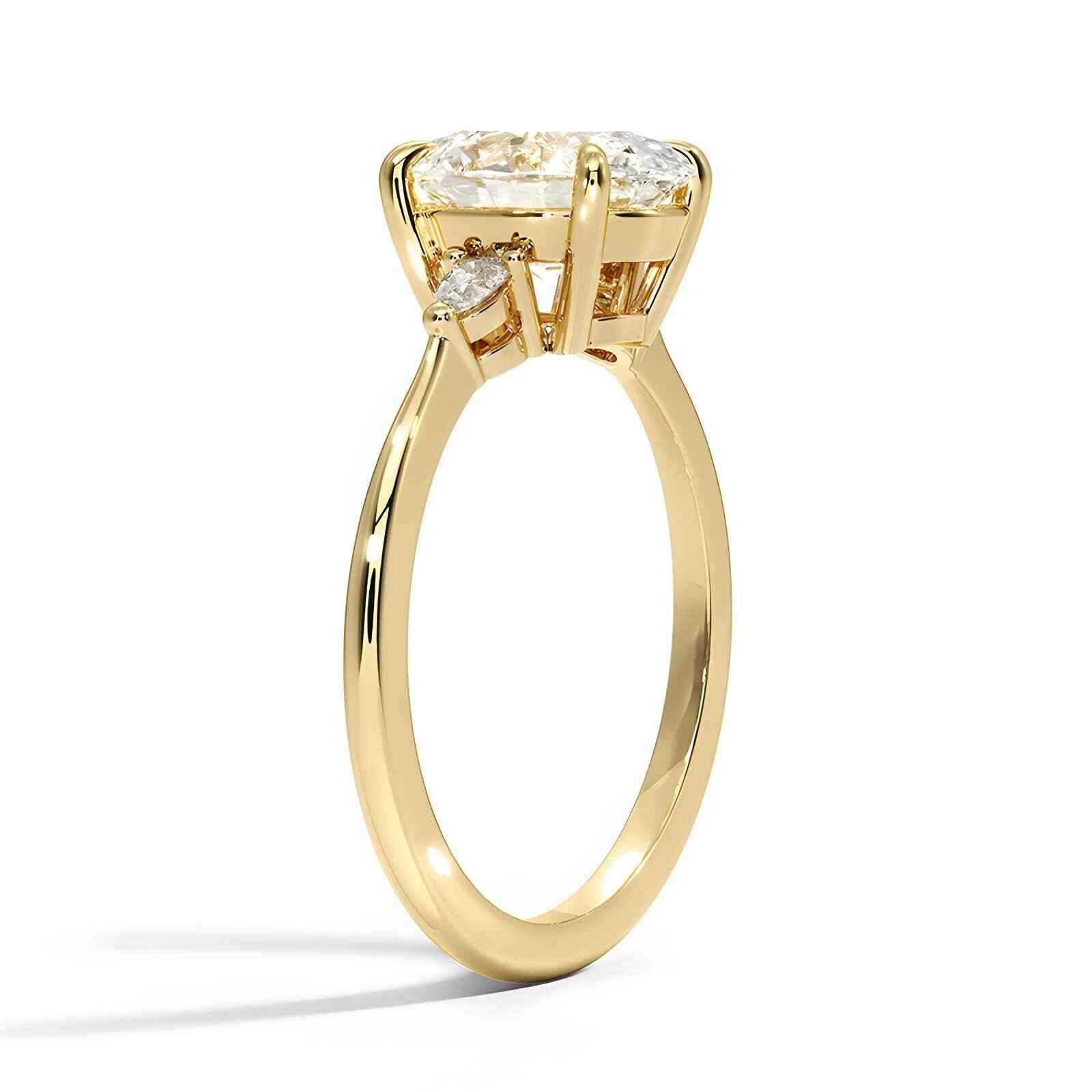 Three stone oval cut moissanite engagement ring in yellow, rose, white gold and platinum – handcrafted in New Zealand by Nura Lab