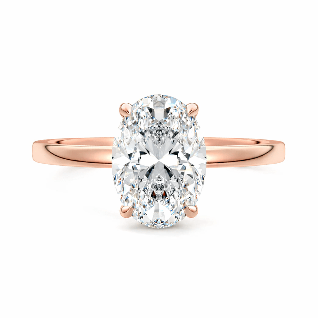 Rose gold ring with a large oval diamond on a white background