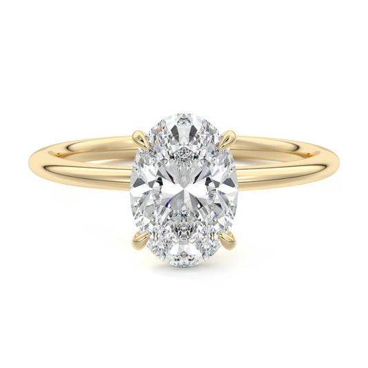 Gold ring with a large oval diamond on a white background