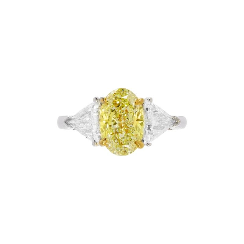 Three stone oval cut yellow diamond trilogy engagement ring in 18K gold