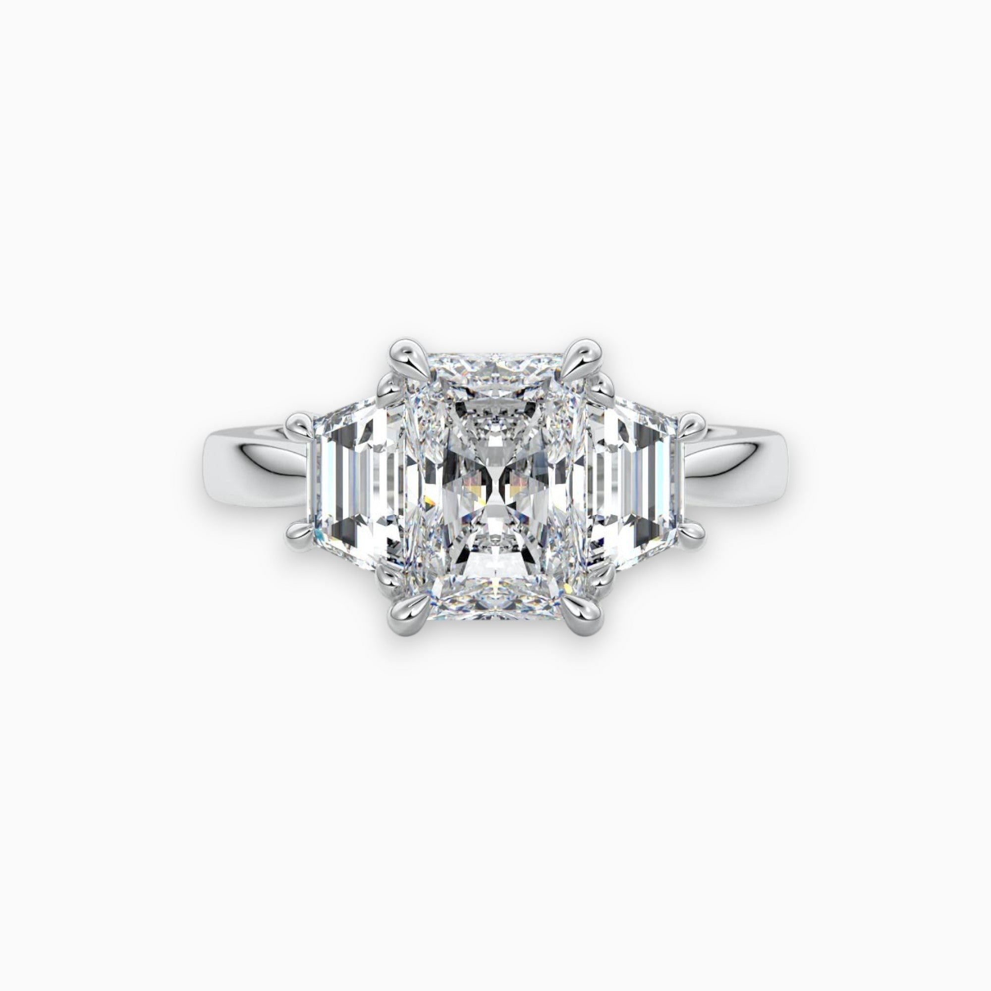 three stone radiant trilogy ring in yellow gold