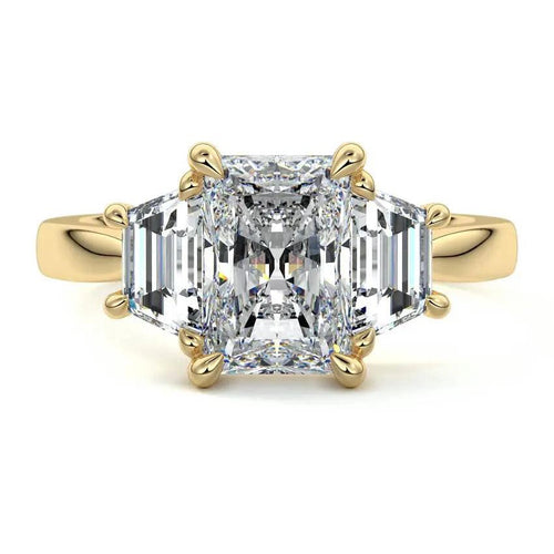 Lab-grown three-stone radiant cut and trapezoid side diamond engagement ring in yellow and white gold – made in New Zealand by Nura Lab