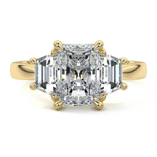 Lab-grown three-stone radiant cut and trapezoid side diamond engagement ring in yellow and white gold – made in New Zealand by Nura Lab